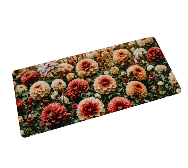 Vibrant pink, blush, apricot and red dahlia flower desk mat for your office space from Spruce and Heron.