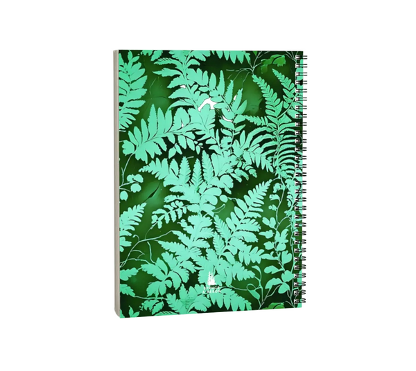 A spiral-bound notebook with a dark green background and a light mint green fern pattern on the cover, shown on a light white background -