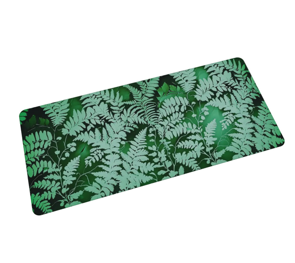 A deep green and sage green fern deskmat - rectangular from Spruce and Heron.
