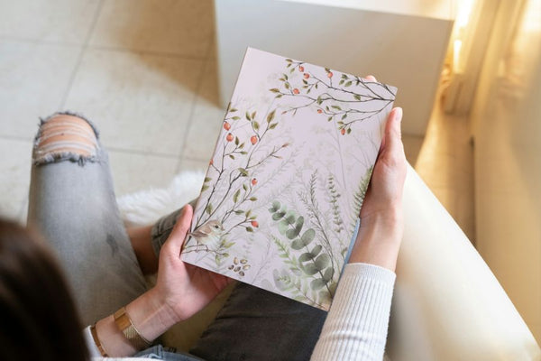 Faceless woman holding the Ferns in Fall notebook from Spruce and Heron.