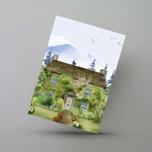 A cottage in a forest watercolor greeting card.