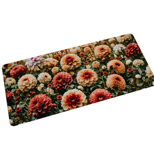 Vibrant pink, blush, apricot and red dahlia flower desk mat for your office space from Spruce and Heron.
