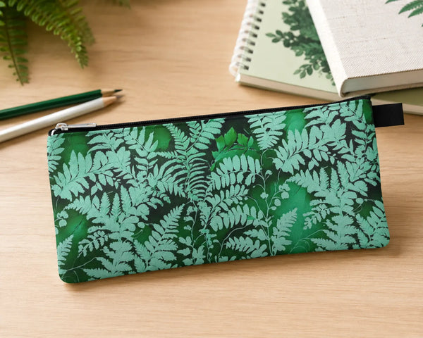 Fern Pencil Case from Spruce & Heron on a light table with pencils and notebooks. 