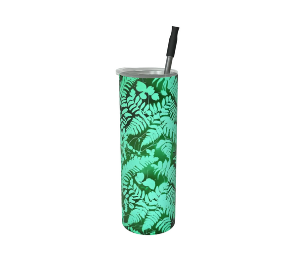 A tall insulated tumbler with a black straw, featuring a green and teal fern pattern, shown on a white background - Spruce and Heron.