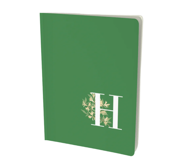 H monogram notebook in green with floral touches.