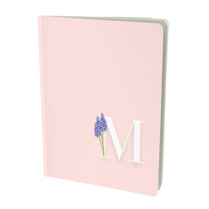 M monogram notebook with a floral embellishment.