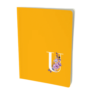 U monogram notebook in golden colour with floral embellishment.