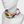 Mannequin wearing a floral patterned scarf on a white background